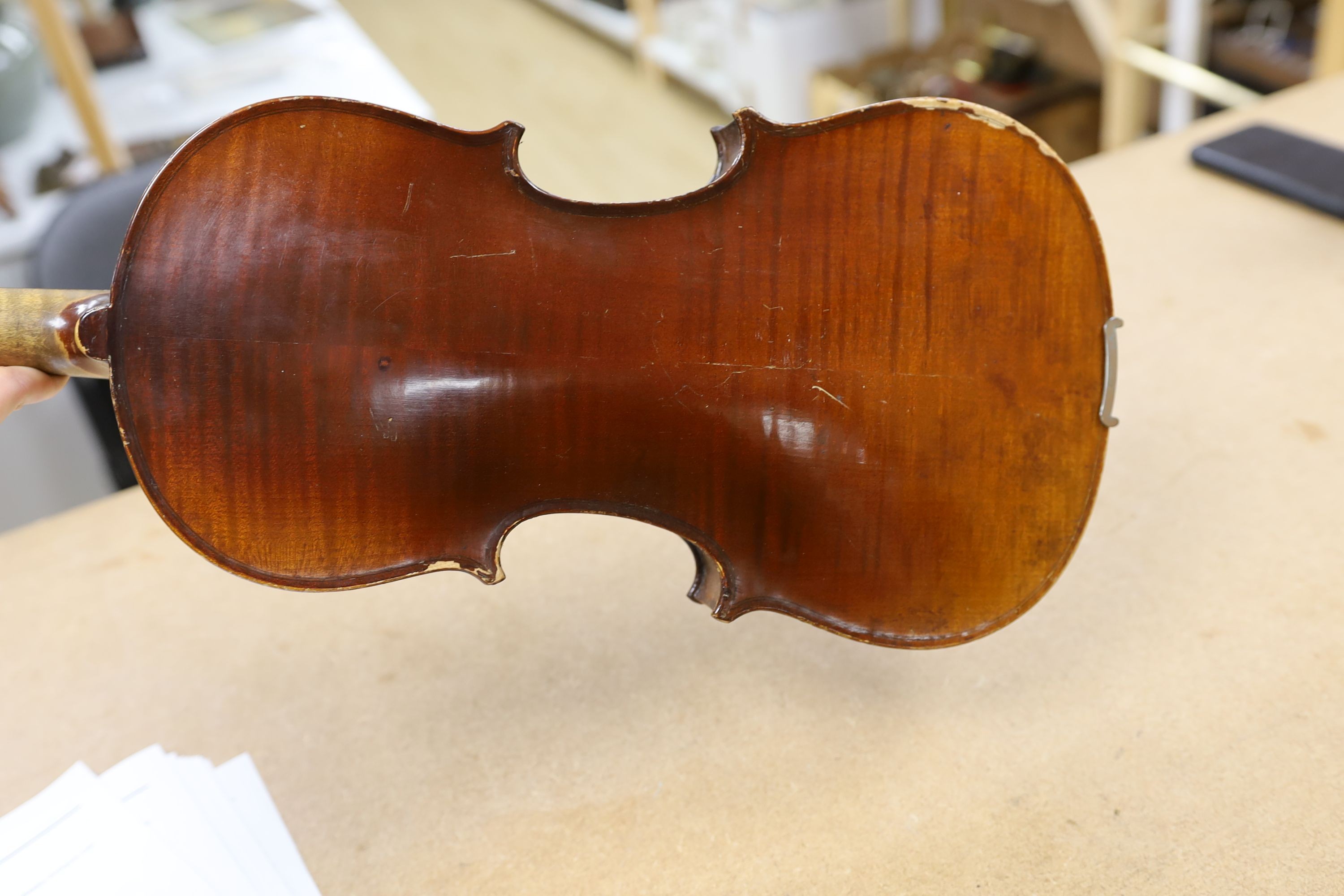 A cased violin, with bow